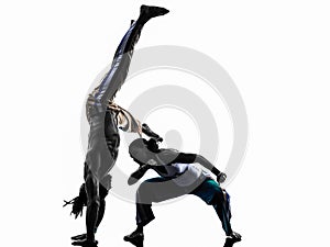 Couple capoeira dancers dancing silhouette