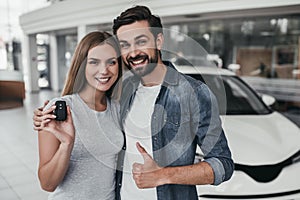 Couple at car dealership