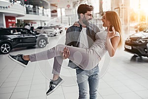 Couple at car dealership