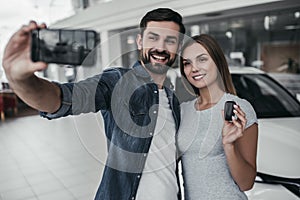Couple at car dealership