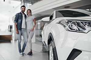 Couple at car dealership