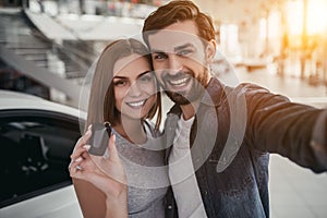 Couple at car dealership