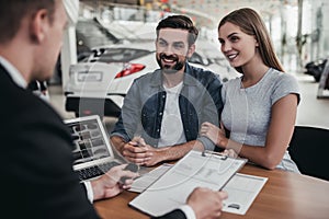 Couple at car dealership