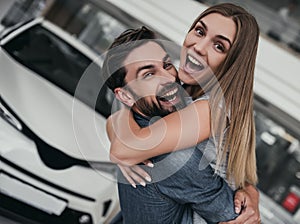 Couple at car dealership