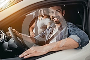 Couple at car dealership