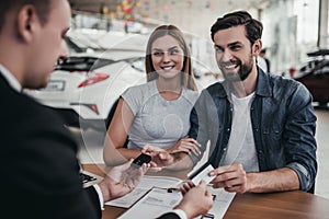 Couple at car dealership