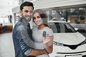 Couple at car dealership