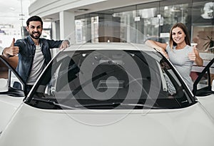 Couple at car dealership