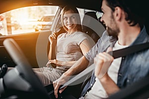 Couple at car dealership