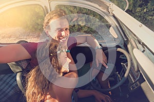 Couple in a car at sunset