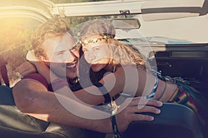 Couple in a car at sunset