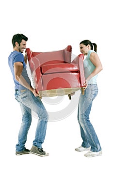 Couple carrying a chair