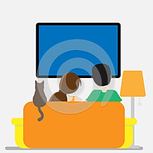 Couple and cat at home in front of tv