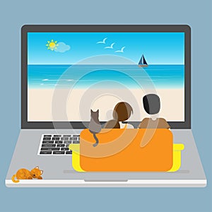 Couple and a cat sitting on a sofa on a laptop and looking at the screen with a seascape image