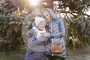 Couple of Caucasian mature woman and senior female are happy to spend time on Christmas and New Year holidays together, smiling