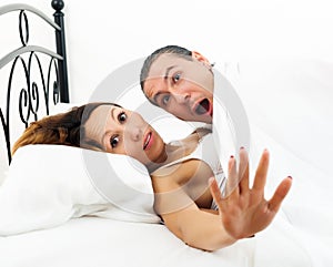 Couple caught in bed