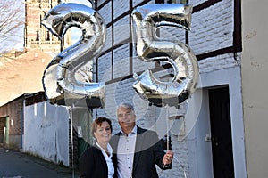 Couple celebrating  25th marriage anniversary