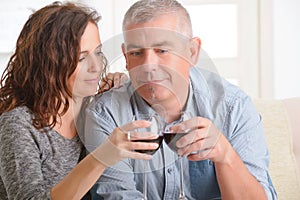 Couple celebrating in home