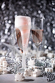A couple celebrating with sparkling rose wine