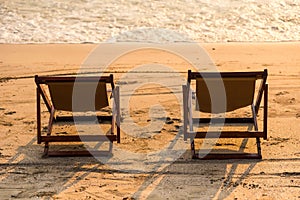 A couple of chairs on sunset beach