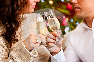 Couple with champagne on Christmas Eve