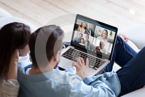 Couple chatting with relatives via videoconference video call application