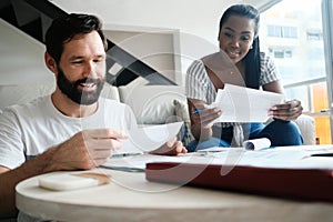 Couple Checking Bills for Home Budget and Tax