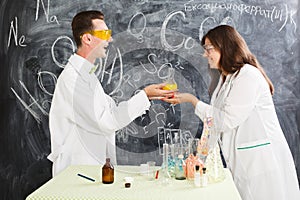 Couple chemists enjoy of chemistry experiment