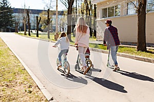 Couple with children on bicycles