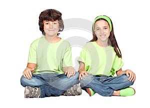 Couple of children with same clothes sitting