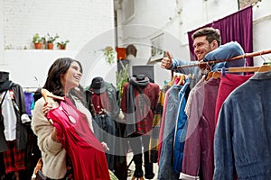 Couple choosing clothes at vintage clothing store