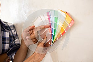 Couple choosing color for painting there new home