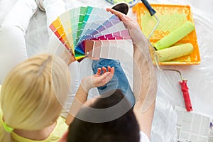 Couple choosing colors to paint new house