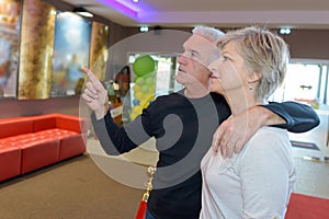 Couple choosing couch in decoration store photo