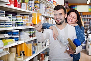 Couple choosing house decoration materials