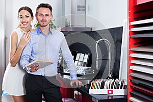 Couple choosing kitchen fronts materials