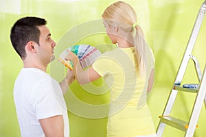 Couple choosing paint for painting