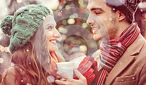 couple on christmas market drinking hot spiced wine