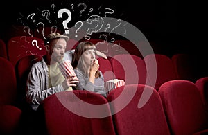 Couple in cinema with questions