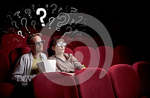 Couple in cinema with questions