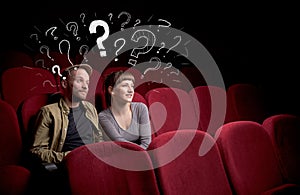 Couple in cinema with questions