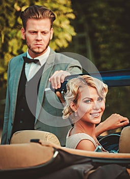 Couple in a classic car