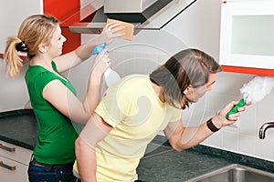 Couple cleaning apartment