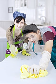 Couple cleaning new home photo