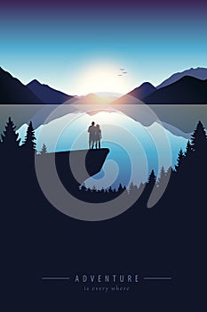 Couple on a cliff adventure in nature by the lake with mountain view
