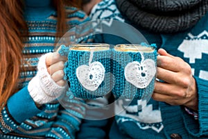 Couple with coffee cups in winter