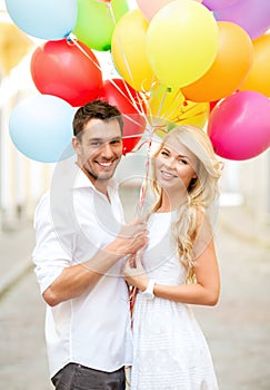 Couple with colorful balloons