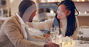Couple, communication and bonding or love in restaurant, laughing and affection in marriage. People, smile and