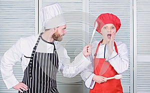 Couple compete in culinary arts. Kitchen rules. Culinary battle concept. Woman and bearded man culinary show competitors