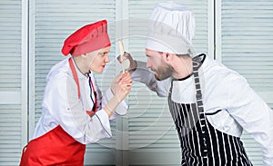 Couple compete in culinary arts. Who cook better. Culinary battle concept. Woman and bearded man culinary show